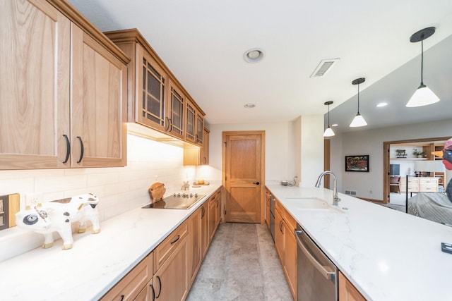 kitchen featuring stainless steel dishwasher, pendant lighting, black electric cooktop, backsplash, and sink