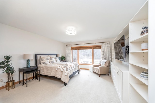 bedroom featuring light carpet