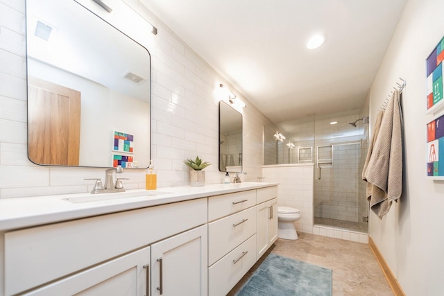 bathroom featuring an enclosed shower, vanity, and toilet