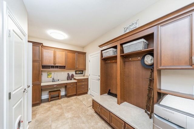 mudroom featuring built in desk