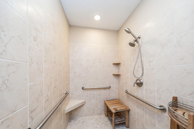 bathroom featuring tiled shower