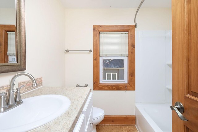 full bathroom with shower / bathing tub combination, vanity, and toilet