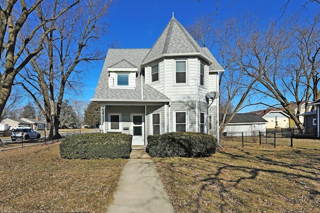 victorian-style house with a front lawn