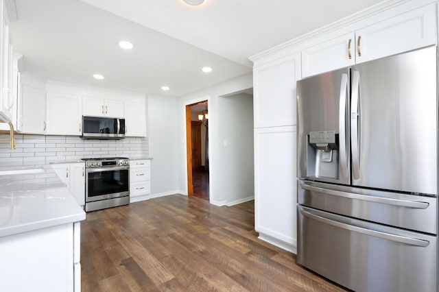 kitchen with stainless steel appliances and white cabinets