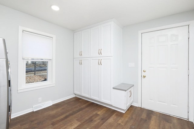 mudroom with dark hardwood / wood-style floors