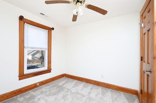 carpeted empty room with ceiling fan