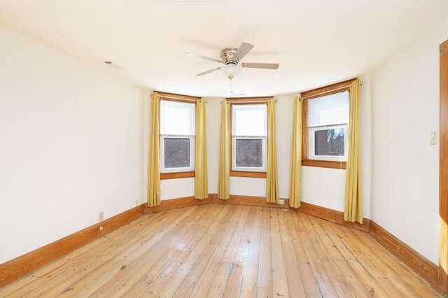 spare room with ceiling fan and light hardwood / wood-style floors