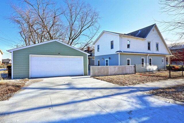 view of home's exterior featuring a garage and an outdoor structure