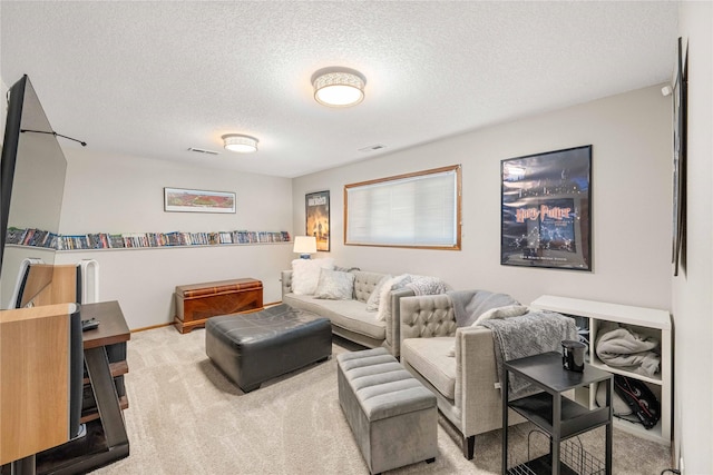 living room featuring a textured ceiling and light carpet