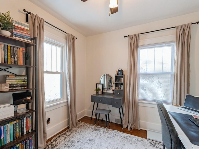 office area with ceiling fan, a healthy amount of sunlight, and light hardwood / wood-style flooring