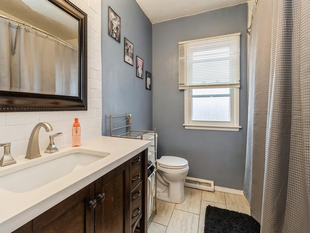 bathroom with a textured ceiling, tile patterned flooring, toilet, decorative backsplash, and vanity