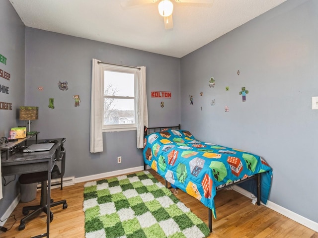 bedroom featuring ceiling fan and hardwood / wood-style floors