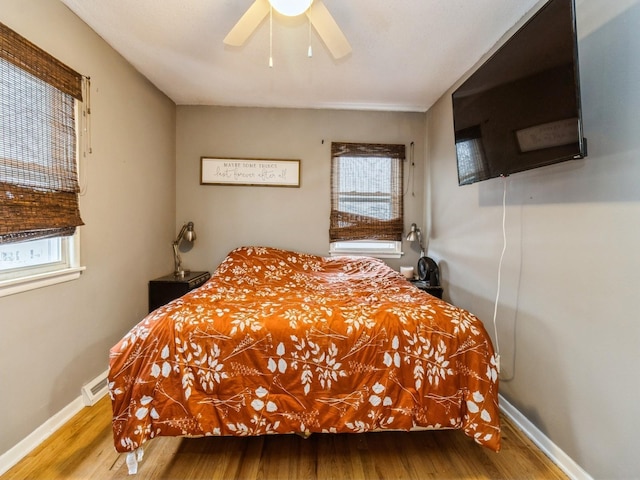 bedroom featuring ceiling fan and hardwood / wood-style floors