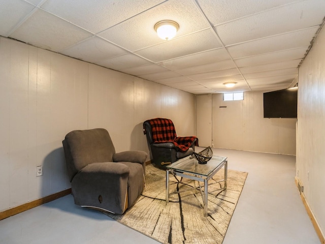 living room with a drop ceiling