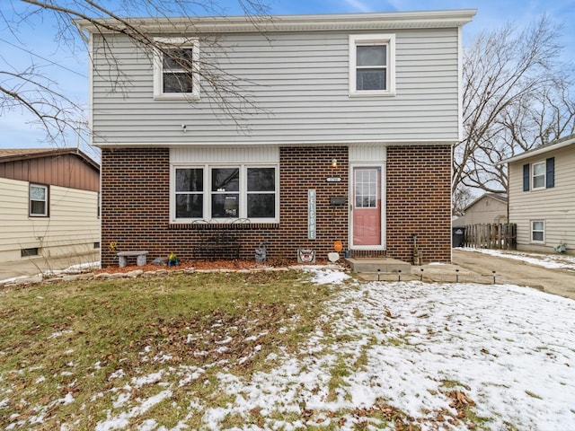 view of front of home with a yard