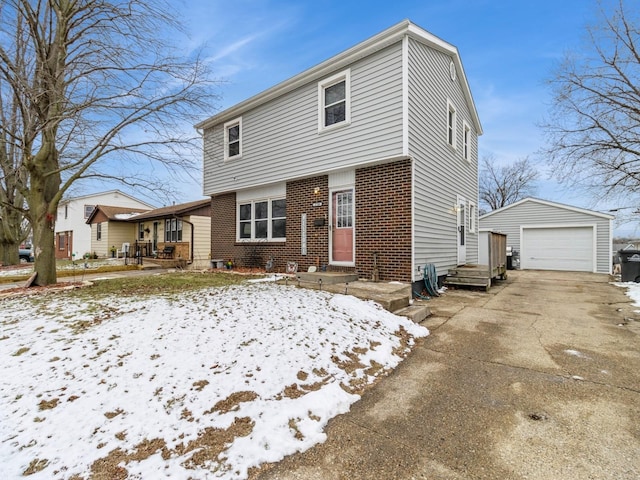 front of property with a garage and an outdoor structure