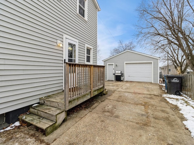 view of property exterior with a garage and an outbuilding