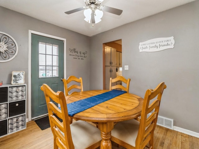 dining area featuring ceiling fan and light hardwood / wood-style flooring