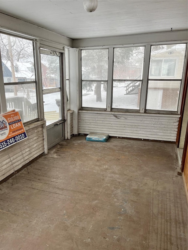 unfurnished sunroom with plenty of natural light