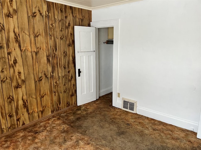 carpeted spare room with ornamental molding