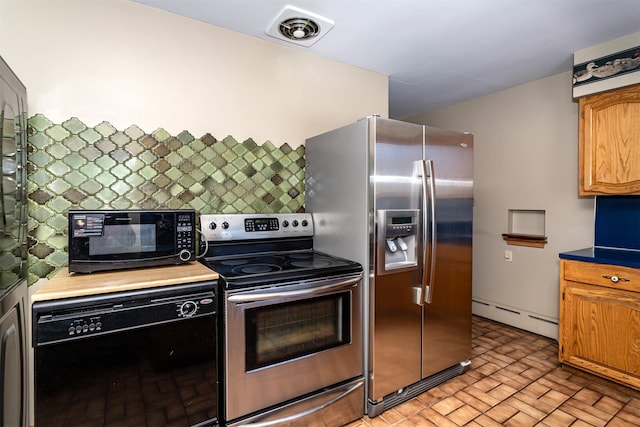 kitchen with black appliances and a baseboard heating unit