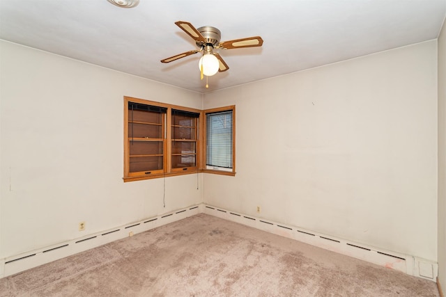 unfurnished room with ceiling fan and carpet floors