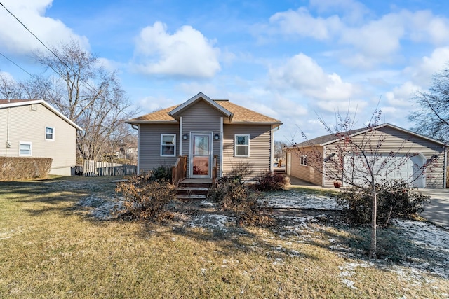 view of front of property featuring a garage and a front yard