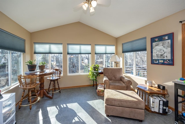 sunroom with vaulted ceiling, ceiling fan, and a healthy amount of sunlight