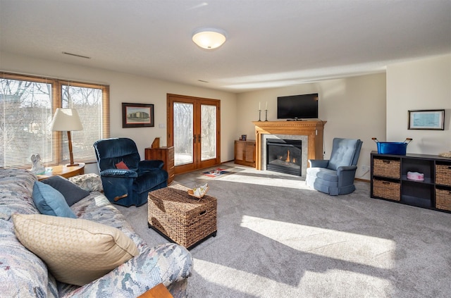 living room featuring french doors and carpet floors