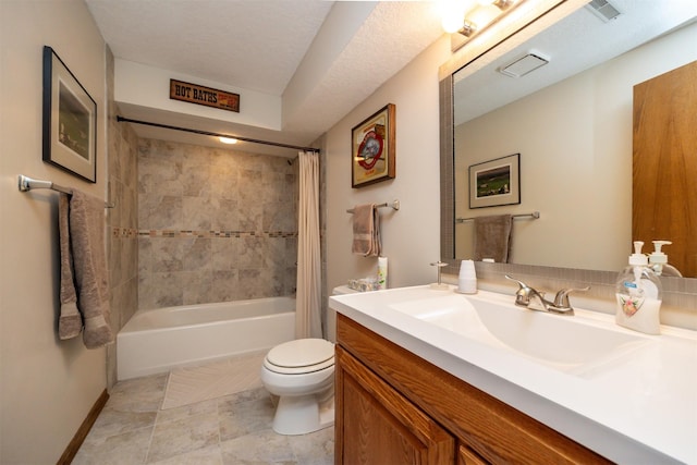 full bathroom with vanity, shower / bath combo with shower curtain, and toilet