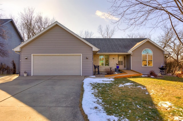 ranch-style house featuring a front lawn and a garage