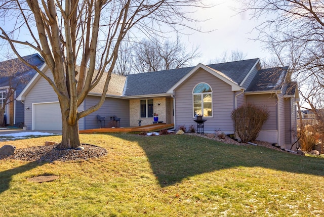 single story home featuring a front yard and a garage