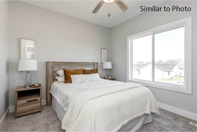 bedroom featuring ceiling fan and light colored carpet