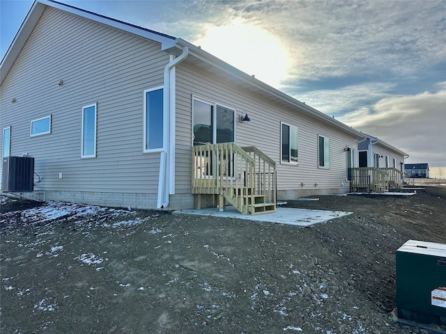 view of side of property featuring central AC unit