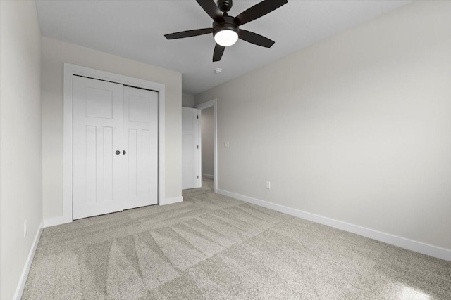 1991 S Warrior Ln, Waukee, IA 50263 - unfurnished bedroom featuring light colored carpet, baseboards, and a closet