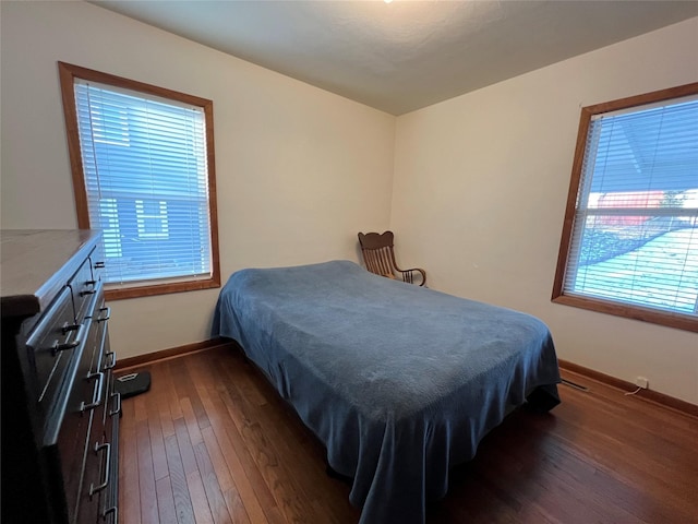 bedroom featuring dark wood-type flooring