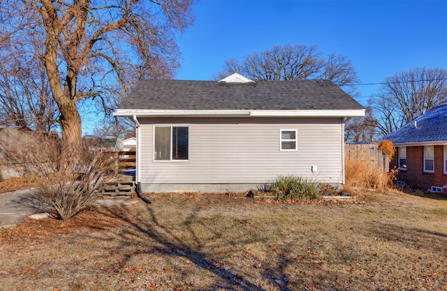 view of side of property with a yard