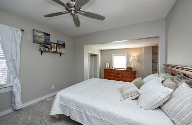 bedroom featuring ceiling fan and carpet