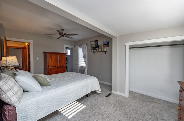 carpeted bedroom with ceiling fan