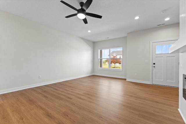 1995 S Warrior Ln, Waukee, IA 50263 - entryway featuring healthy amount of natural light, a ceiling fan, wood finished floors, baseboards, and recessed lighting