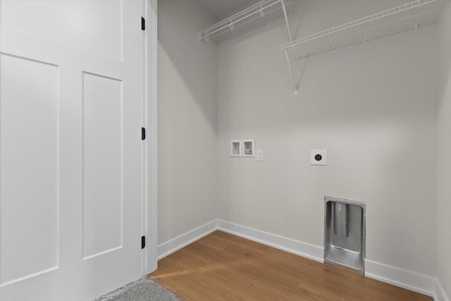 1995 S Warrior Ln, Waukee, IA 50263 - washroom with hookup for a washing machine, hookup for an electric dryer, wood finished floors, and baseboards