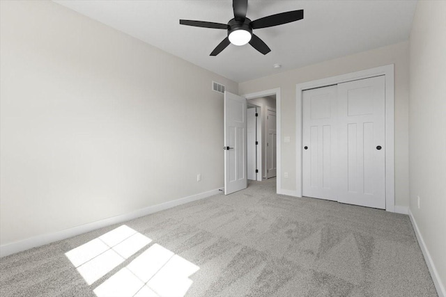 1995 S Warrior Ln, Waukee, IA 50263 - unfurnished bedroom with carpet floors, baseboards, a closet, and ceiling fan