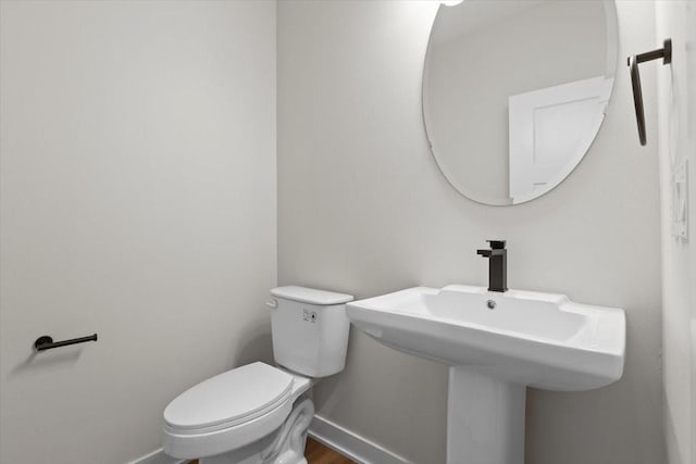 1995 S Warrior Ln, Waukee, IA 50263 - half bath featuring baseboards and toilet