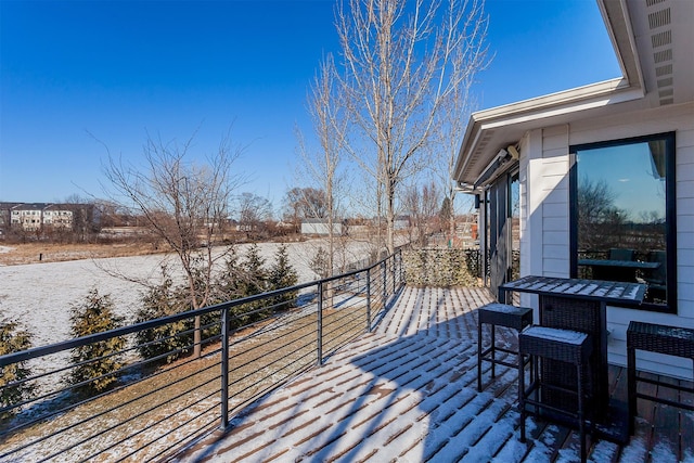 view of snow covered deck