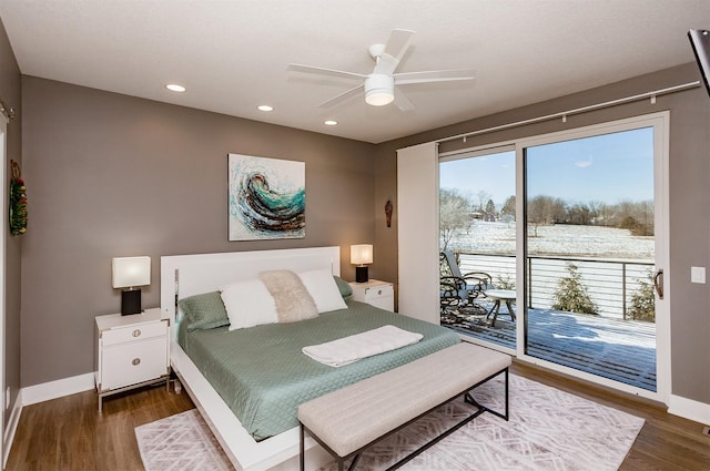 bedroom featuring dark wood-type flooring, access to outside, and ceiling fan