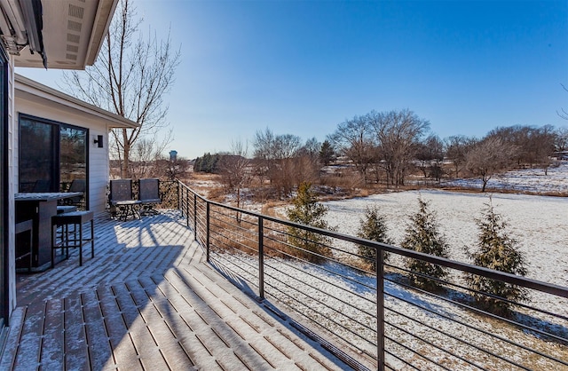 view of snow covered deck