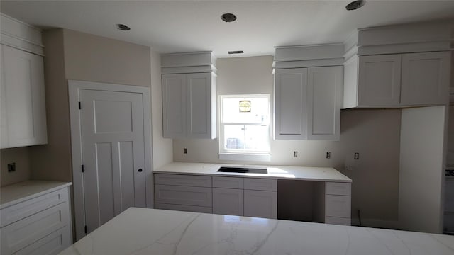 kitchen featuring light stone counters