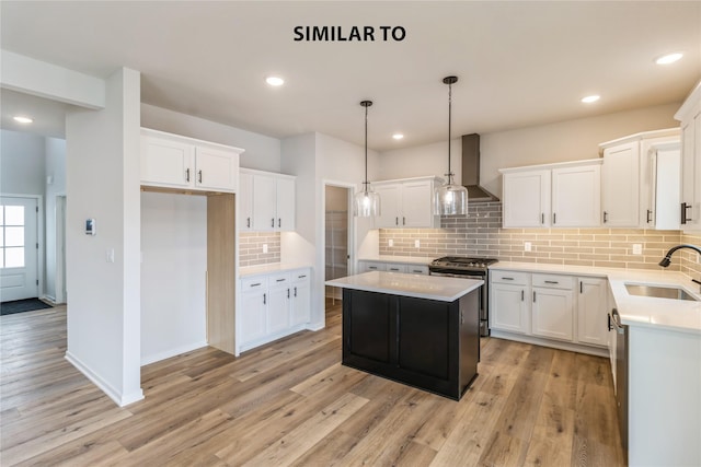 kitchen featuring sink, white cabinets, appliances with stainless steel finishes, and a kitchen island