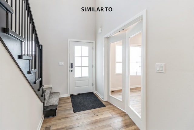 foyer with light wood-type flooring