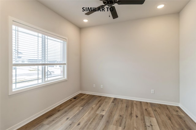 empty room featuring light wood-type flooring and ceiling fan